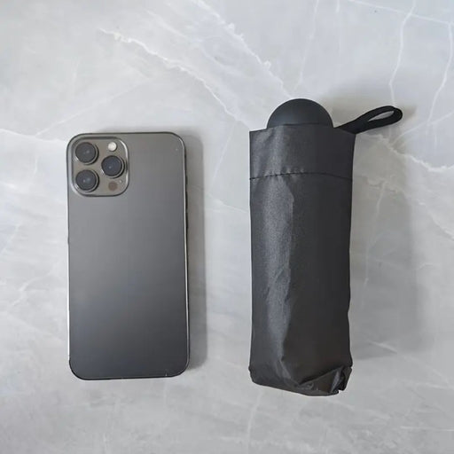 Compact Black Mini Capsule Umbrella - Portable, Foldable, Manual Open with Sunscreen & Coating
