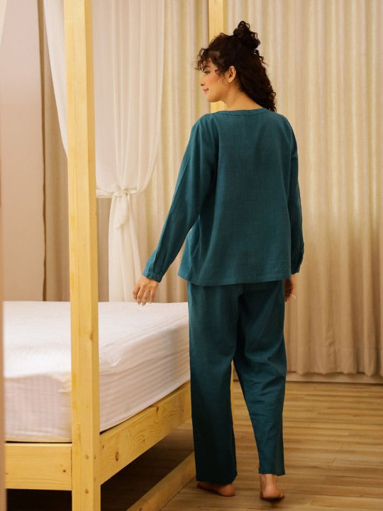The Set Includes a Breezy Top and Matching Bottoms, Tailored for a Relaxed Fit That Allows You to Mo