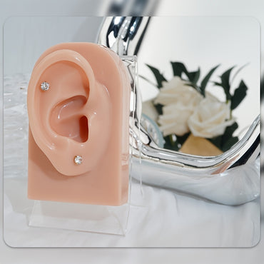 Pair of 4Mm White Synthetic Zirconia Earrings with Floral Relief Design and Ear Plugs